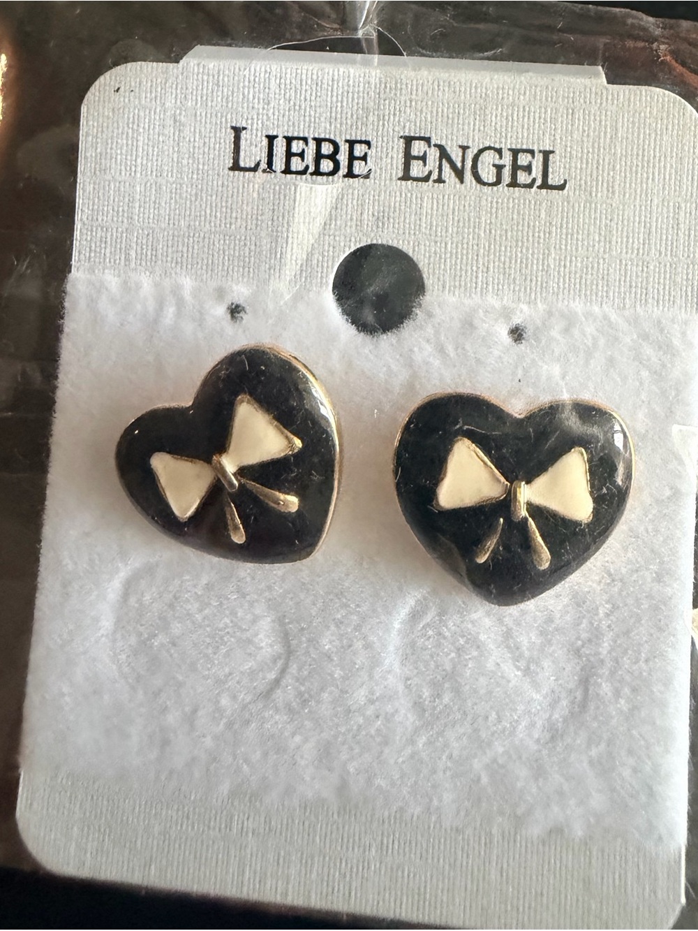 Black Heart Stud Earrings with Cream Enamel Bow Accent